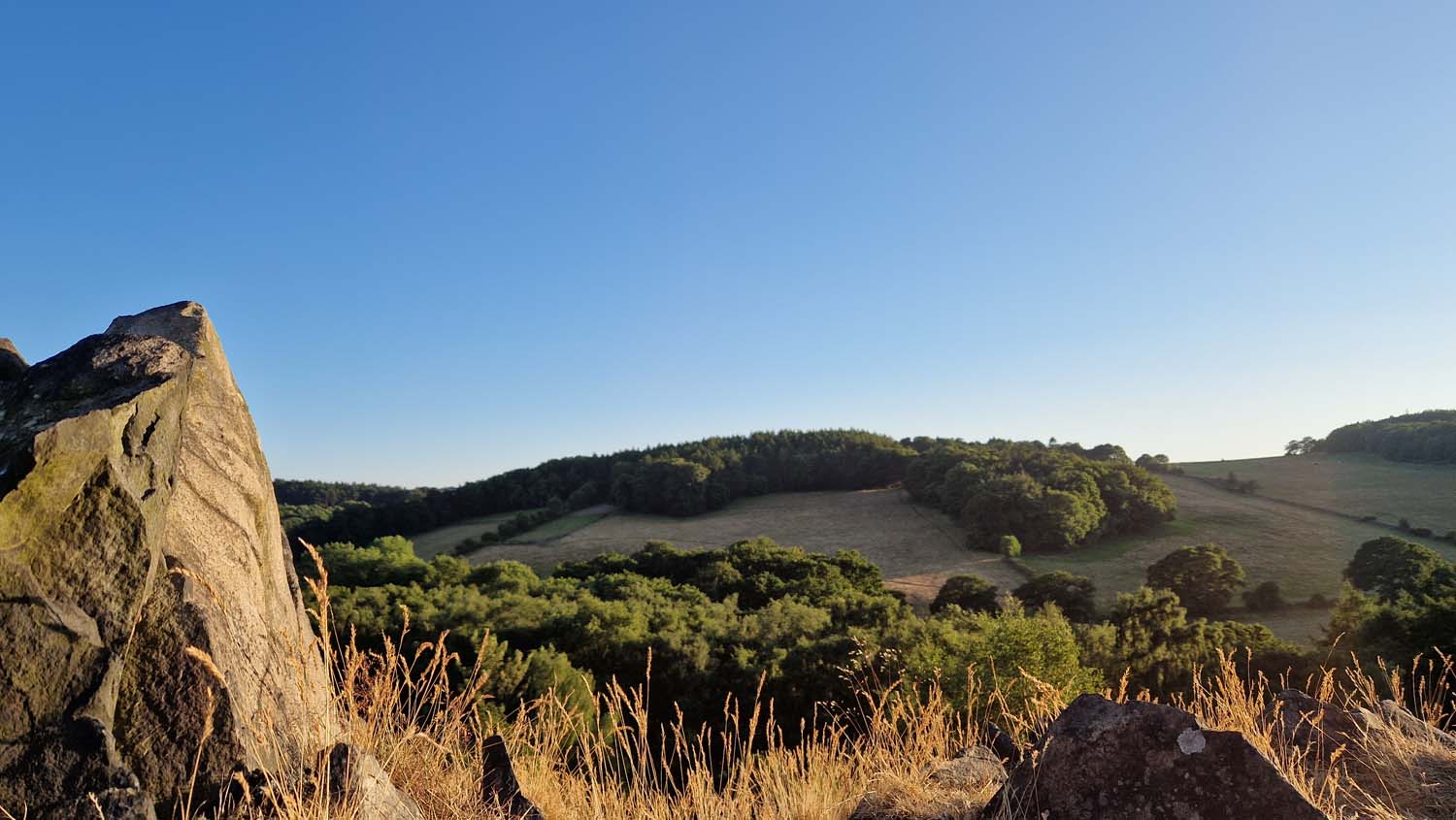 A late evening view of the landscape at Buck Hill, with a rock in the near distance