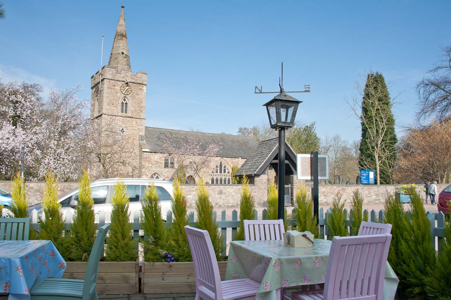 A view from a cafe patio across the rock to a church