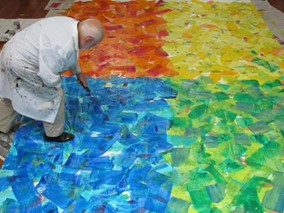Eric Carle creating a collage