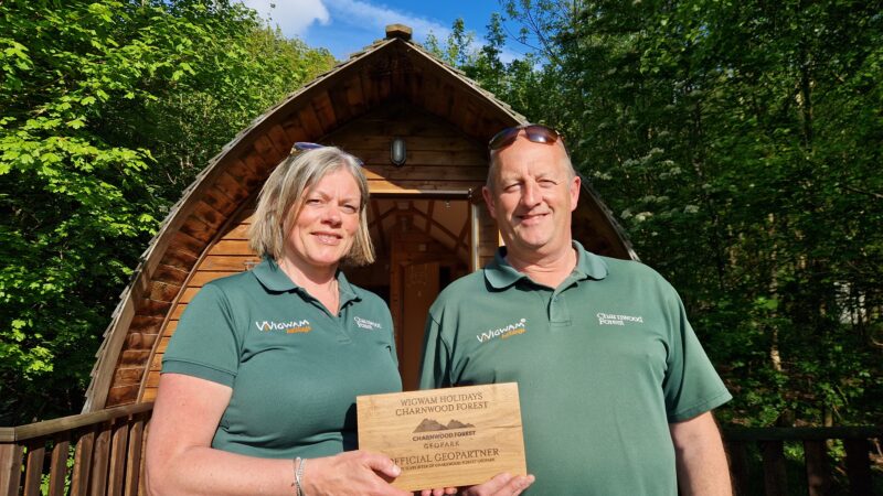The team from Charnwood Forest WigWams stand with the Geopartner Sign