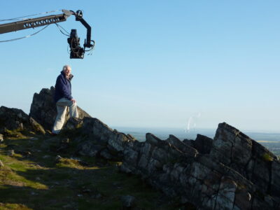 Sir David Attenborough filming his First Life TV series at the summit of Beacon Hill.