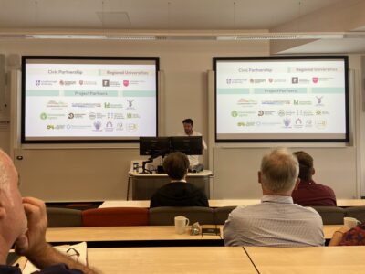 Josh Wolstenholme gives a presentation
