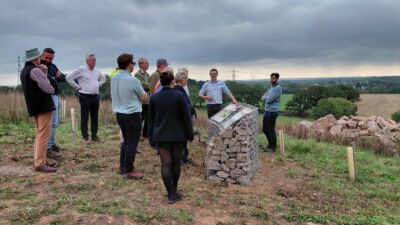 A group of people looking at some interpretation at Mountsorrel Quarry View